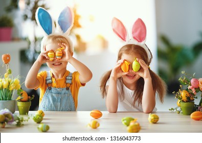 Happy Easter! Funny Funny Children Boy And Girl With Ears Hare Getting Ready For Holiday
