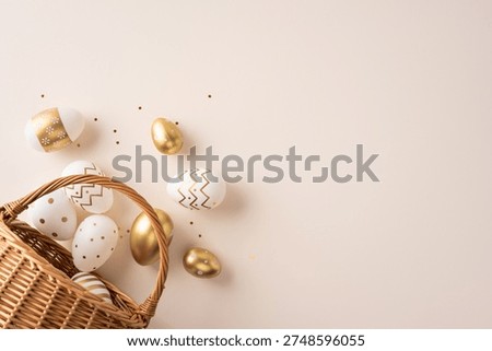 Happy Easter greeting featuring elegant gold and white decorated eggs spilling from a wicker basket onto a soft pastel background ideal for holiday cards and seasonal decoration