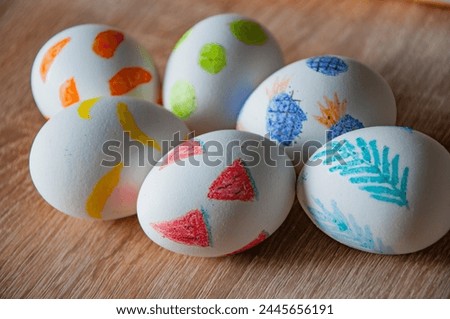 Happy Easter holiday celebration. Easter bunny hunt. Spring holiday at Sunday. Eastertide and Eastertime. Good Friday. Hunting eggs. Painted eggs. Easter eggs on wooden table. Chocolate Easter eggs.