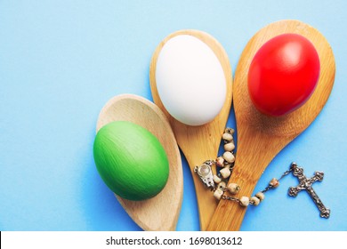 Happy Easter holiday Italian card, Easter eggs as the color of the Italy flag on blue - Shutterstock ID 1698013612