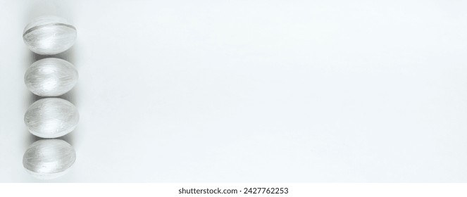 Happy Easter. Painted eggs on isolated white background. Top view. Copy space for text, Banner