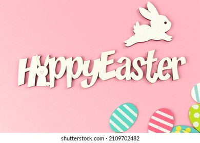 Happy Easter Spring Holiday Greeting Card With Colorful Easter Eggs On A Bright Pink Background, Top View, Flat Lay Design