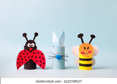 Happy easter spring toy collection on blue background for kids holiday party concept background. Paper crafts, DIY. creative idea from toilet roll. reuse, recycle handmade