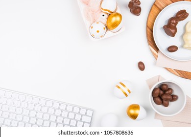 Happy Easter! Stylish stationery background with chocolate eggs. gold and white eggs and accessories on white background. Table decorating for holiday. Feminine flat lay. Office easter concept. - Powered by Shutterstock