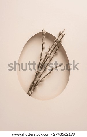 Happy Easter vertical greeting featuring pussywillow branches arranged in a pastel egg-shaped cutout, creating a minimal, elegant spring celebration background