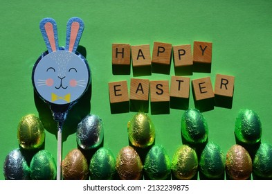 Happy Easter, Words, Chocolate Bunny And Foil Wrapped Eggs 