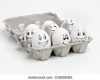 Happy Eggs Make Healthy Food. Studio Shot Of Faces Drawn Onto A Carton Of Eggs.