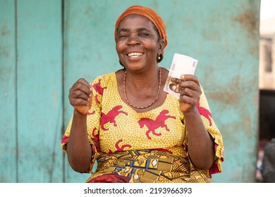 Happy Elderly African Woman Holding Some Money