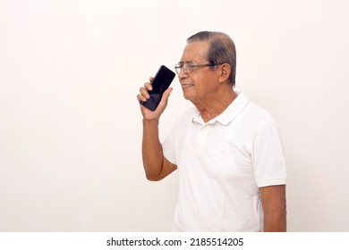 Happy Elderly Asian Man Standing While Talking On The Phone. Isolated On White Background