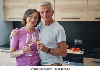 Happy Elderly Couple Celebrating Something With Champagne