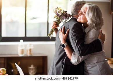 Happy elderly couple celebrating wedding anniversary - Shutterstock ID 489141979