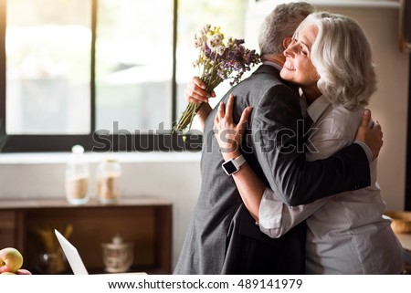 Happy elderly couple celebrating wedding anniversary