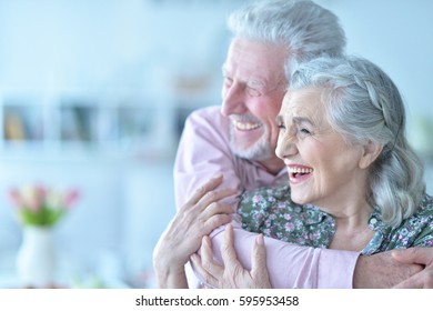 Happy Elderly Couple Embracing