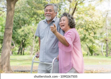 Happy elderly couple with lifestyle after retiree concept. Lovely asian seniors couple walking exercise in the park in the morning.