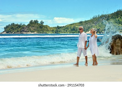 Happy Elderly Couple Rest At Tropical Resort