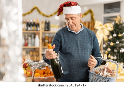 Happy elderly man buying bottles of wine at grocery supermarket to celebrate Christmas - Powered by Shutterstock