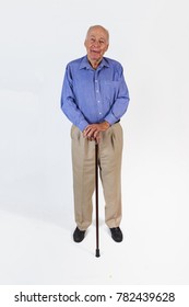 Happy Elderly Man Standing With His Walking Stick Isolated On White