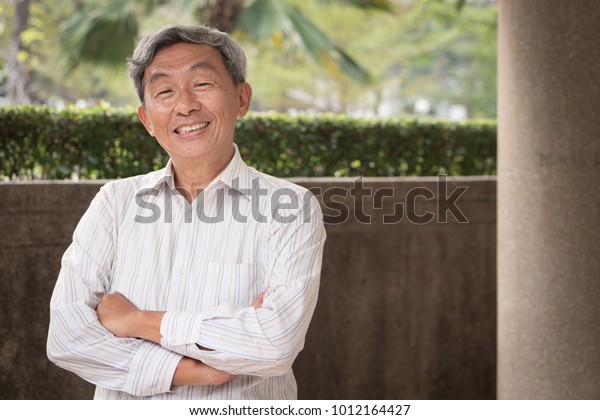 Happy Elderly Old Senior Man Smiling Stock Photo (Edit Now) 1012164427