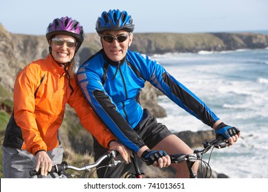 Happy Elderly Senior Couple Cycling 