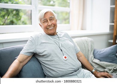 Happy Elderly Senior With Emergency Alarm Button