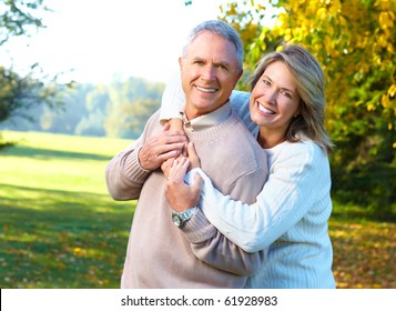 Happy Elderly Seniors Couple In Park