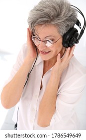 Happy, Elderly Woman With Headphones