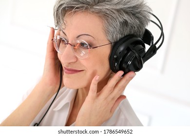 Happy, Elderly Woman With Headphones