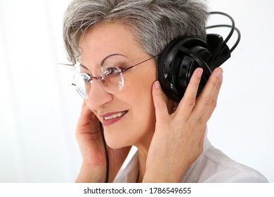 Happy, Elderly Woman With Headphones