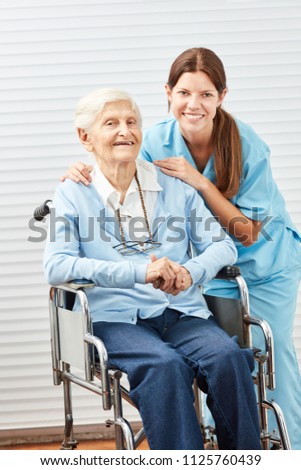 Similar – Doctor talking to elderly patient in a wheelchair