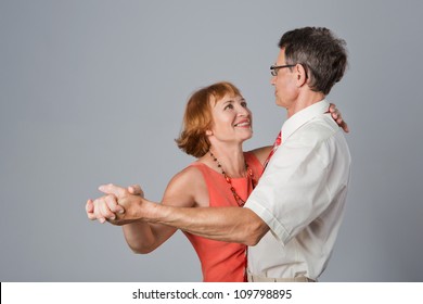 Happy Elegant Senior Couple Is Dancing.