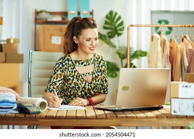 Happy Elegant Small Business Owner Woman In The Office Using Video Chat On Laptop.