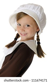 A happy elementary-aged "pilgrim" girl leaning back to say a hello.  On a white background.
