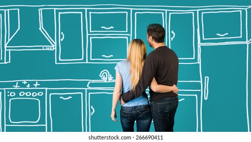 Happy Embracing Couple Planning Their Home Kitchen Furnishing Renovation. Sketch Kitchen Drawing.