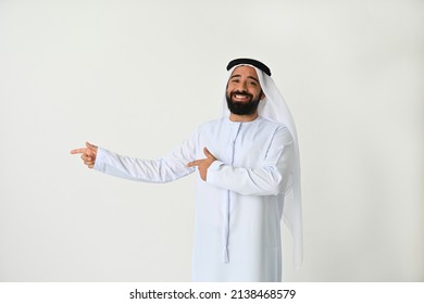 Happy Emirati man pointing to side presenting an offer and excited to show