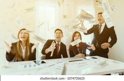 Happy Emotional Asian People Celebrate Success Business Screaming Under Money Rain Falling Down Dollar Bills Banknotes To Become Rich, Modern Office Background,Business Financial Money Freedom Concept