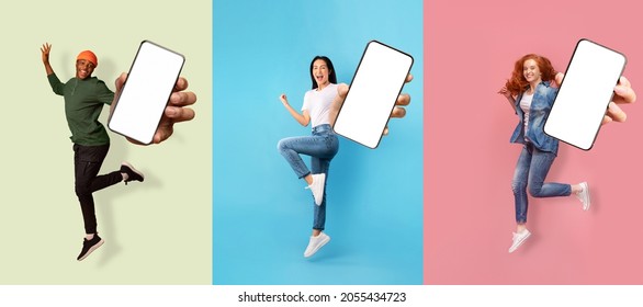 Happy emotional successful international people expressive emotions of joy, show smartphone with empty screen, isolated on colored background. Advertising, app, huge offer and sale, social networks - Shutterstock ID 2055434723