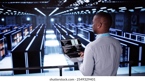 Happy Engineer In Data Center Server Room Configuring AI Technology
