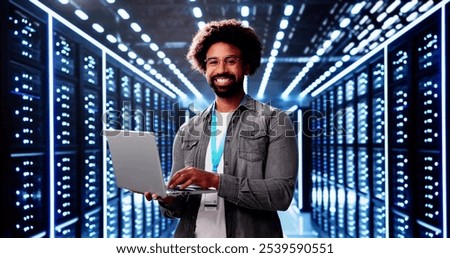 Happy Engineer In Data Center Server Room Configuring AI Technology