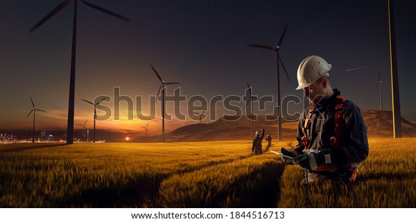 Happy\
engineer feel success after good work. He standing and looking\
beautiful sunset landscape. High quality\
photo