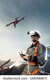 Happy Engineer Using Drone And Vr Helmet For Cheking Solar Station In Roof