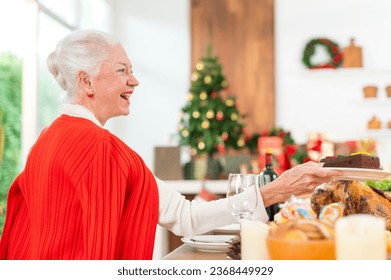 happy and enjoy elder woman have fun celebrating Merry Christmas and hapy New Year with happy family - Powered by Shutterstock