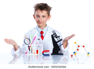 Happy enthusiastic Chemist boy with chemical test tubes and microscope. Isolated on a white background