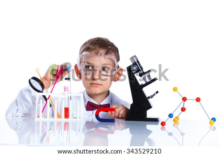 Similar – Image, Stock Photo boy is making science experiments in a laboratory