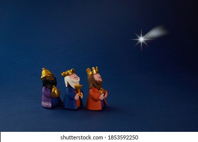 Happy Epiiphany Day. Three Wise Man Ant Star On Blue Background.