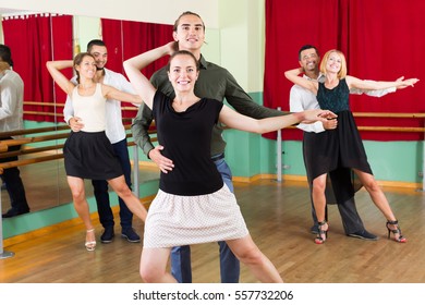 Happy European Men And Women Enjoying Of Tango In Class
