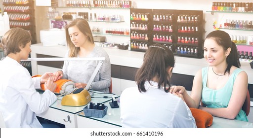 Happy European Women Getting Their Nails Done At Beauty Salon