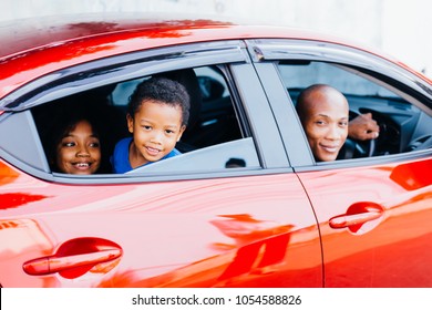 Happy And Excited African American Family Taking A Road Trip With Their Car - Happy Family Togetherness Concept