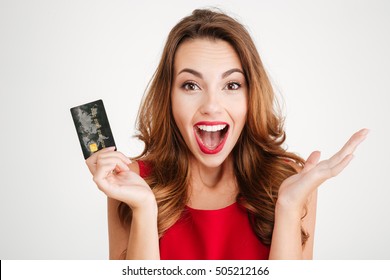 Happy Excited Amazed Young Woman Holding Credit Card Over White Background