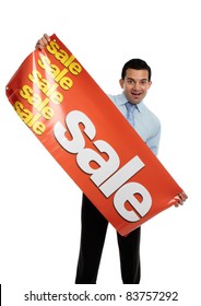 A Happy Excited Businessman, Salesman Or Storeperson Holding A Vinyl Sale Banner Sign Ready To Hang.