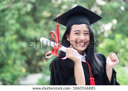 happy excited college student graduating; concept of successful education, happy commencement day, woman education equality, employment opportunity, high education degree, overseas study scholarships